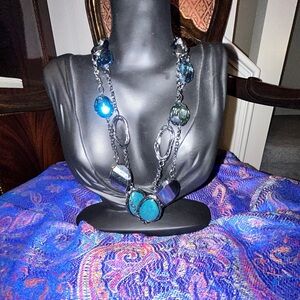 Chicos necklace adorned with black and green stones